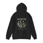 Black pullover hoodie on model, hood up, back moon and “Trust God’s Plan” graphic