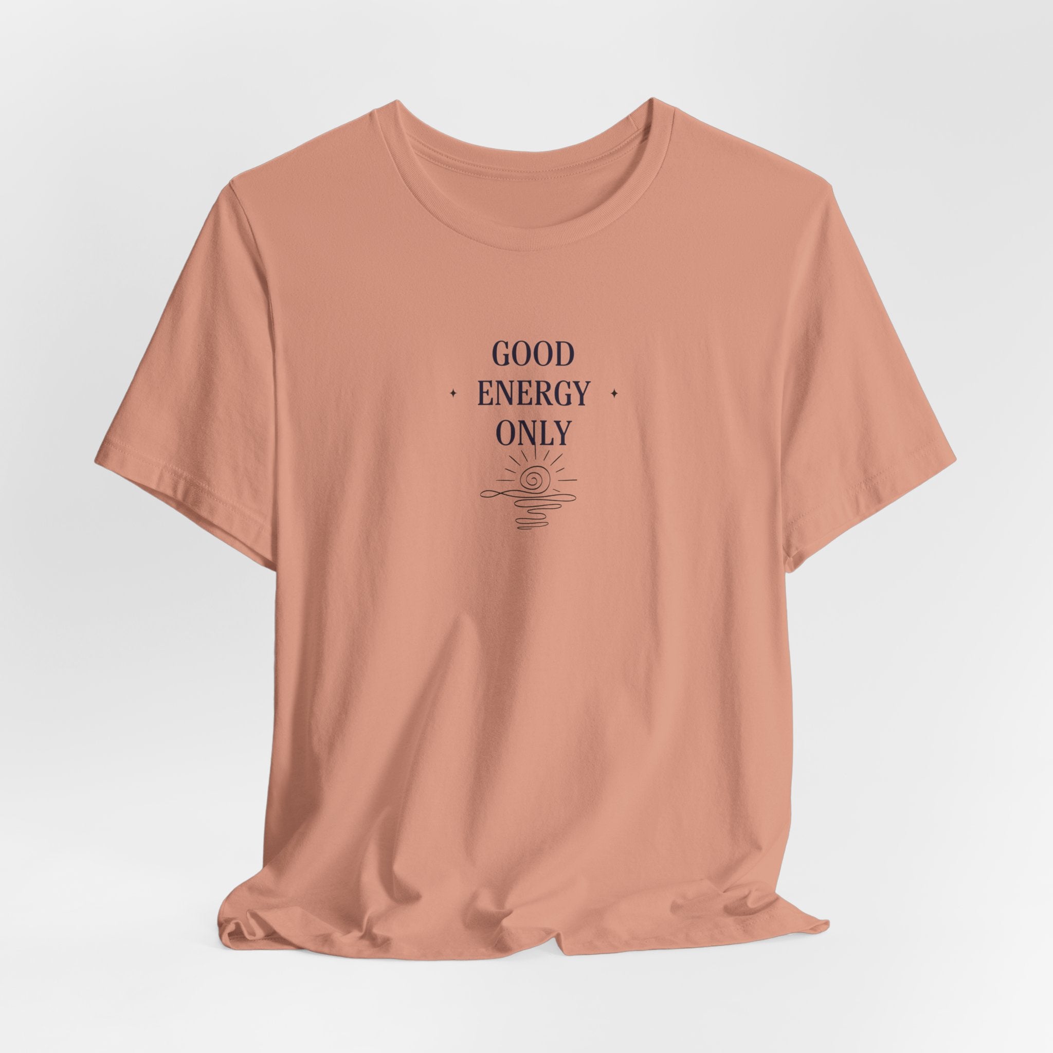 Peach T-shirt with crew neck and 'Good Energy Only' sun graphic on chest