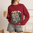 Unisex red sweatshirt worn with “Plant More Trees” nature graphic on front