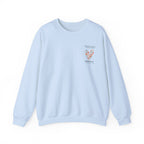 Light blue personalised sweatshirt with floral heart graphic and location text on chest