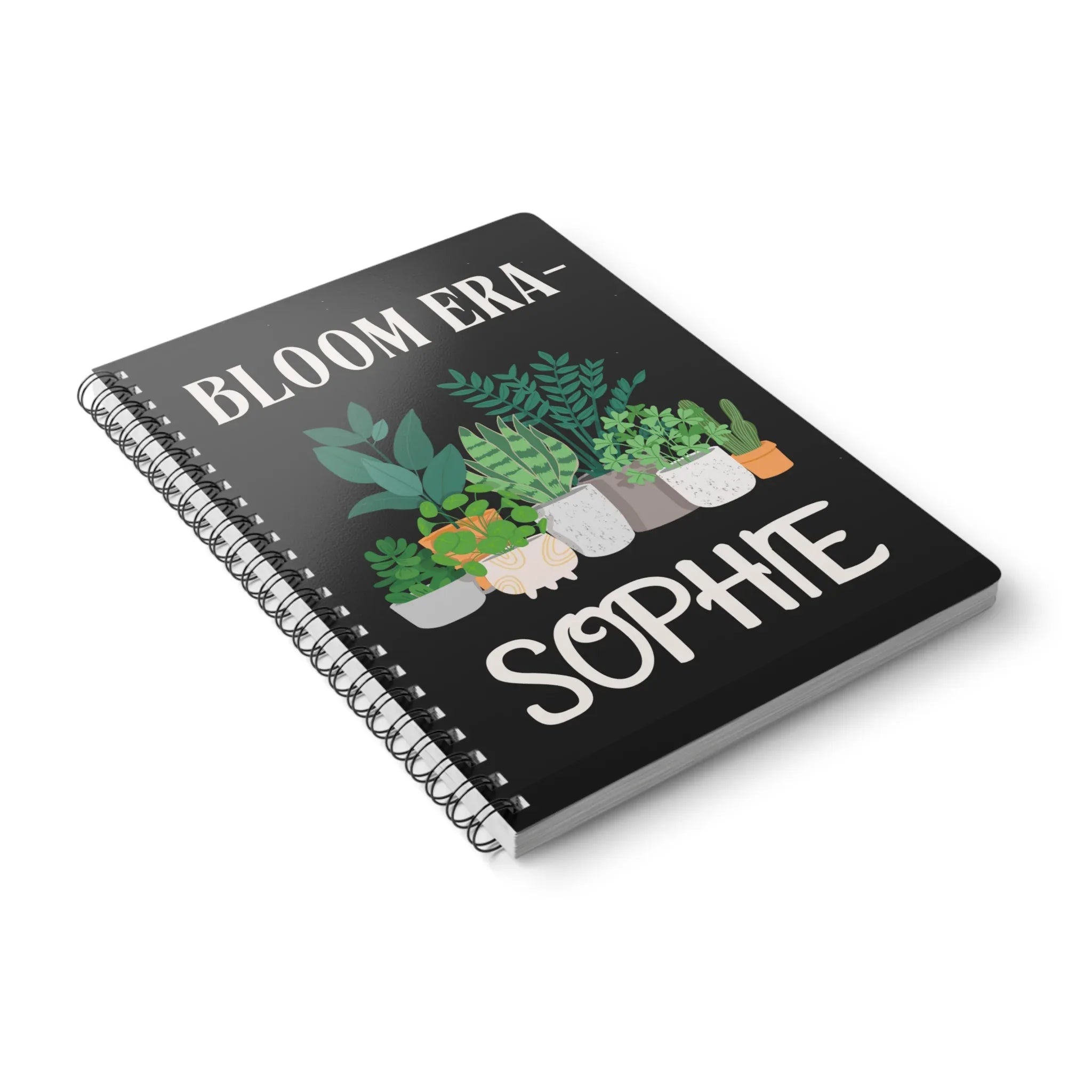 Personalised A5 lined notebook angled view with black cover, floral pots and SOPHIE.