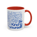 Red accent coffee mug with blue floral line art and 'Be Kind to yourself!' wording