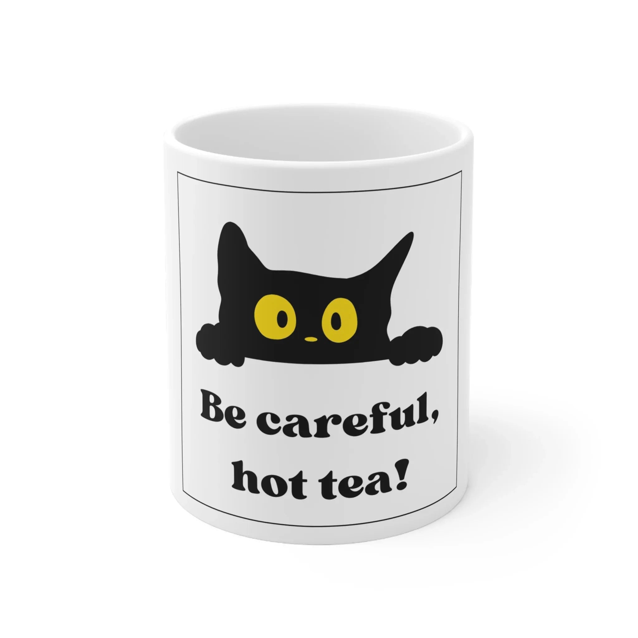 White ceramic mug with black cat and yellow eyes, 'Be careful, hot tea!' text