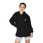 Lightweight hooded windbreaker jacket in black, front zip and drawstring hood, worn by model.