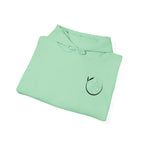 Mint green yoga hoodie, folded with black yoga figure logo