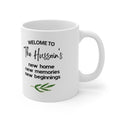 White ceramic mug with 'Welcome to The Hussains' text and green leaf sprig