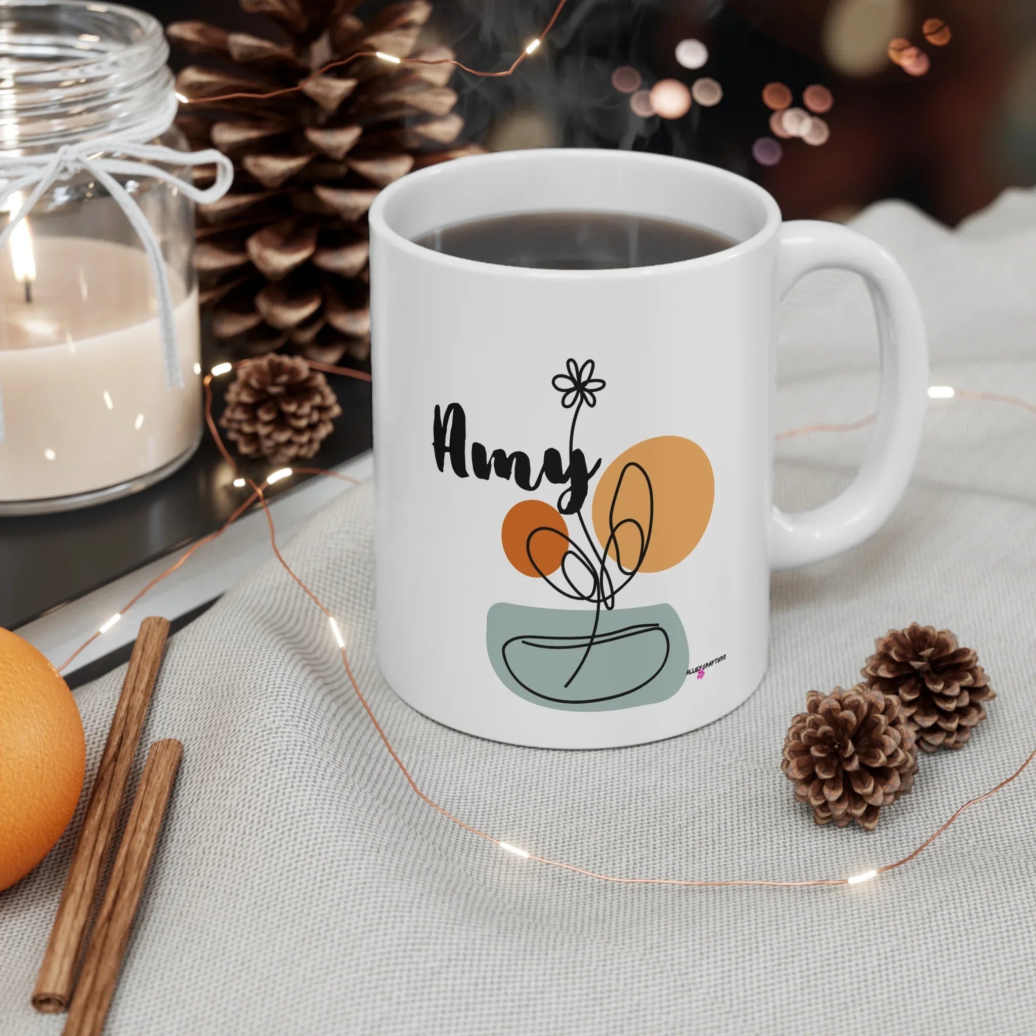 White ceramic mug with personalized Amy name and floral swirl design, front view.
