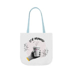 White coffee tote with light blue handles, “STAY GROUNDED” coffee mug design on front