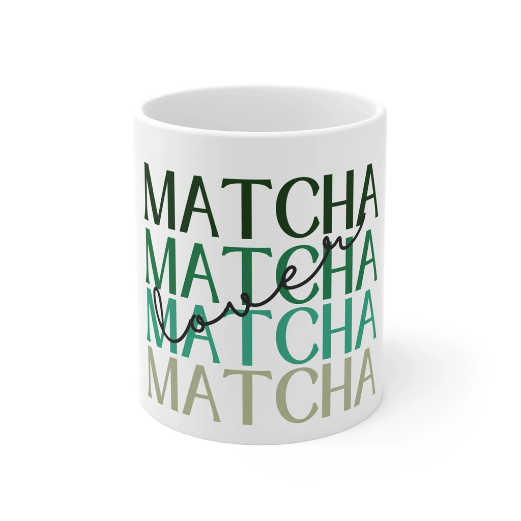 White ceramic matcha mug with green MATCHA lettering, close-up view