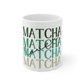 White ceramic matcha mug with green MATCHA lettering, close-up view