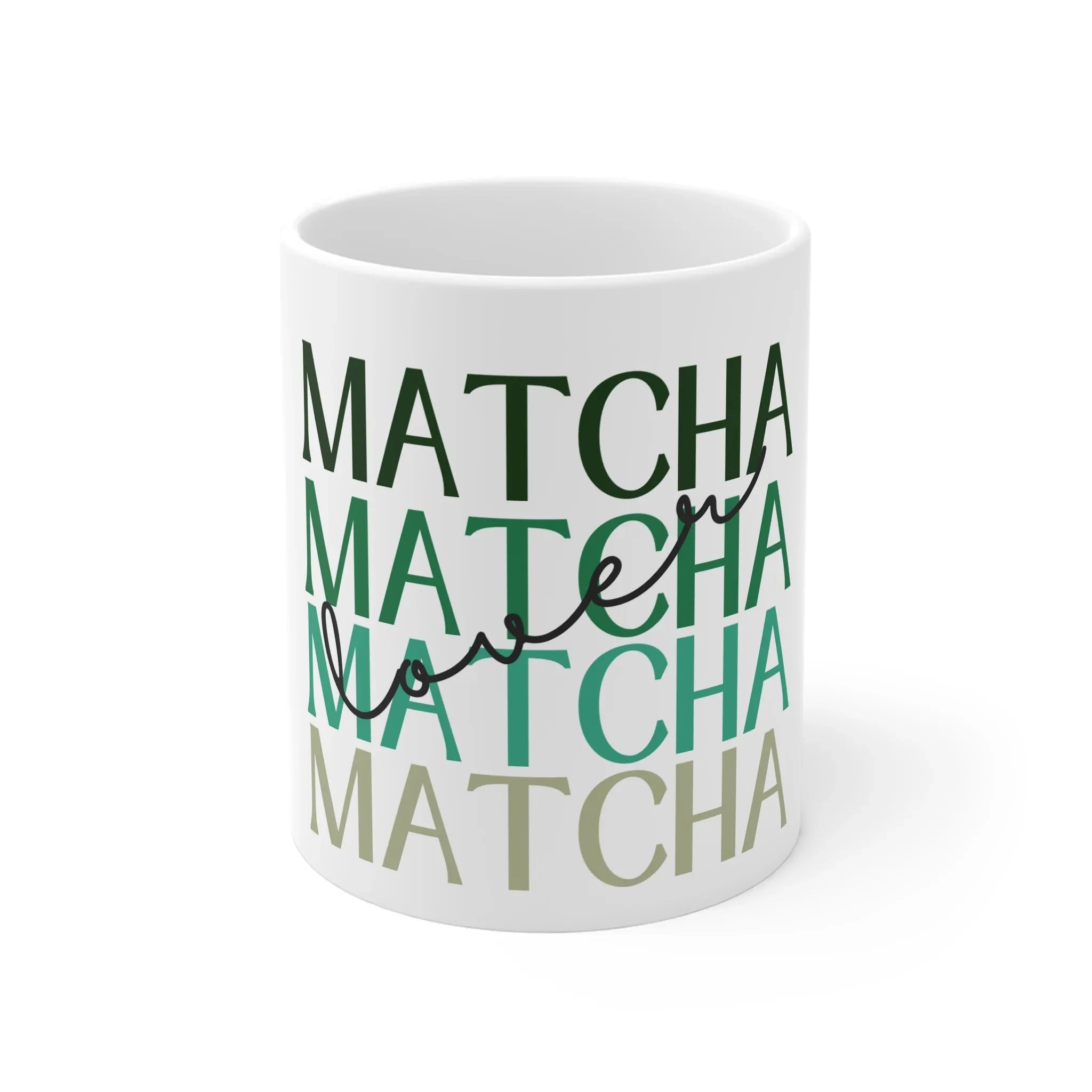 White ceramic matcha mug with green MATCHA lettering, close-up view