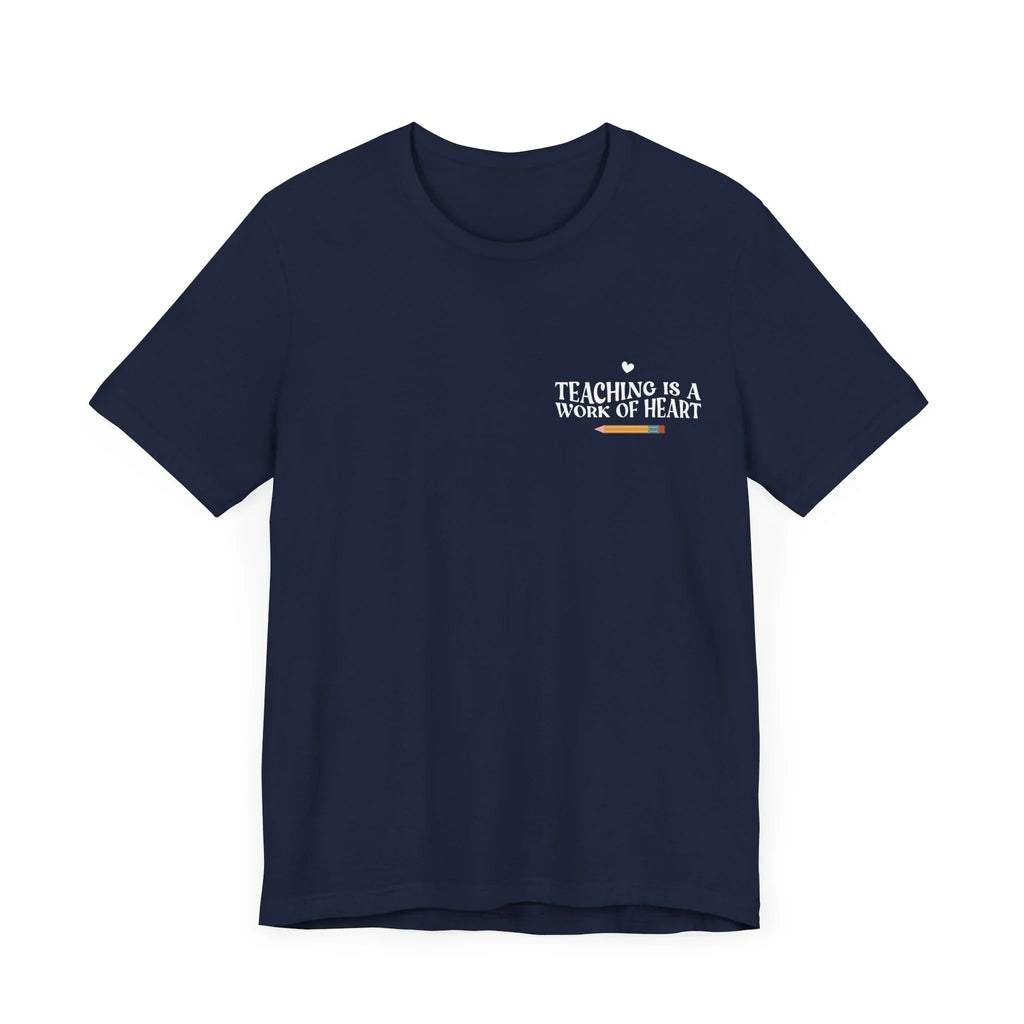 Navy unisex t-shirt with “Teaching is a work of heart” heart-and-text graphic