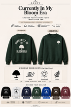 Forest green crewneck sweatshirt with Bloom Era back print and small tree icon
