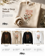 Cream crewneck sweatshirt with Take a Deep Breath floral graphic