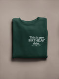 Dark green crewneck birthday sweatshirt with printed “This is my BIRTHDAY shirt”