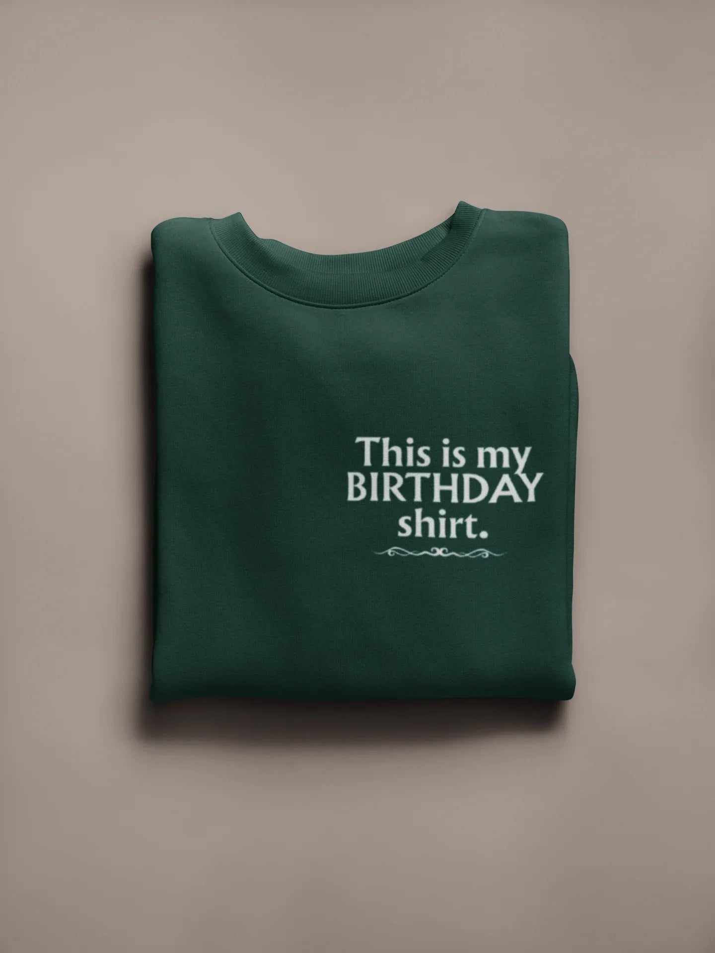 Dark green crewneck birthday sweatshirt with printed “This is my BIRTHDAY shirt”