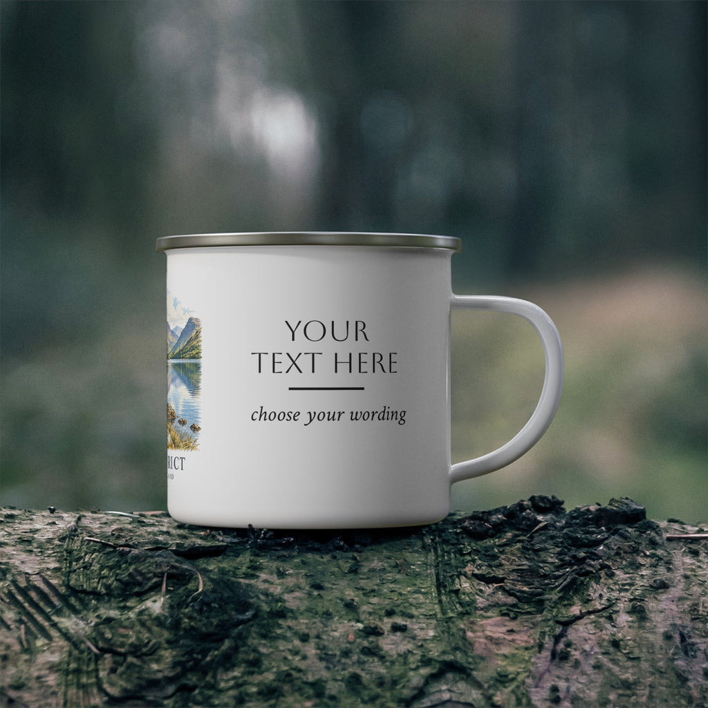 A white enamel-style camping mug with a silver metal rim sits on a log outdoors, with a blurred forest background. The mug has placeholder printed text reading 'YOUR TEXT HERE' and 'choose your wording' alongside a small scenic print on the left side.