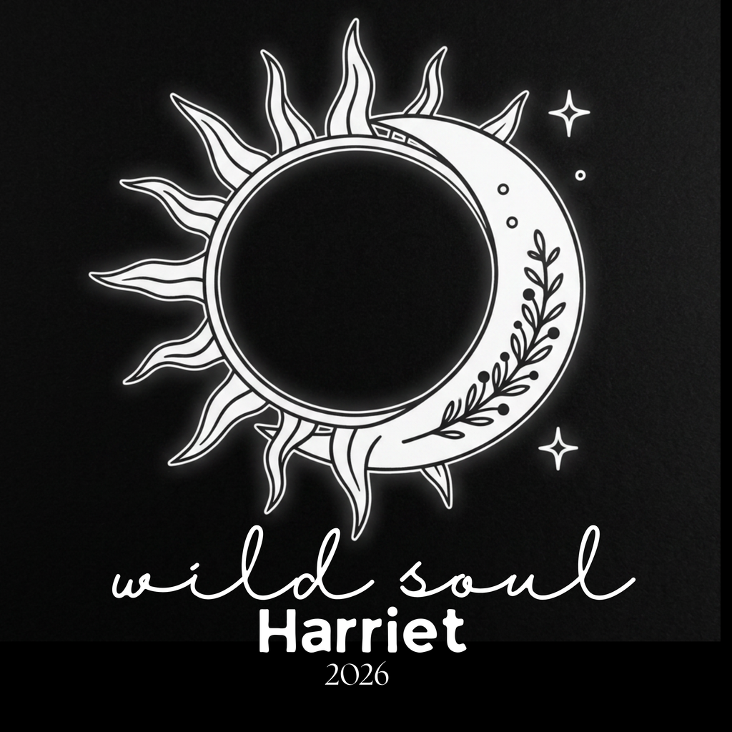Black graphic T-shirt with white sun-and-moon emblem and 'wild soul Harriet 2026'