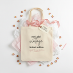 Natural canvas tote bag with 'not old vintage' and 'limited edition' print and pink ribbon