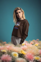 Brown crewneck sweatshirt with 'Sarah's Garden' floral crest on chest.