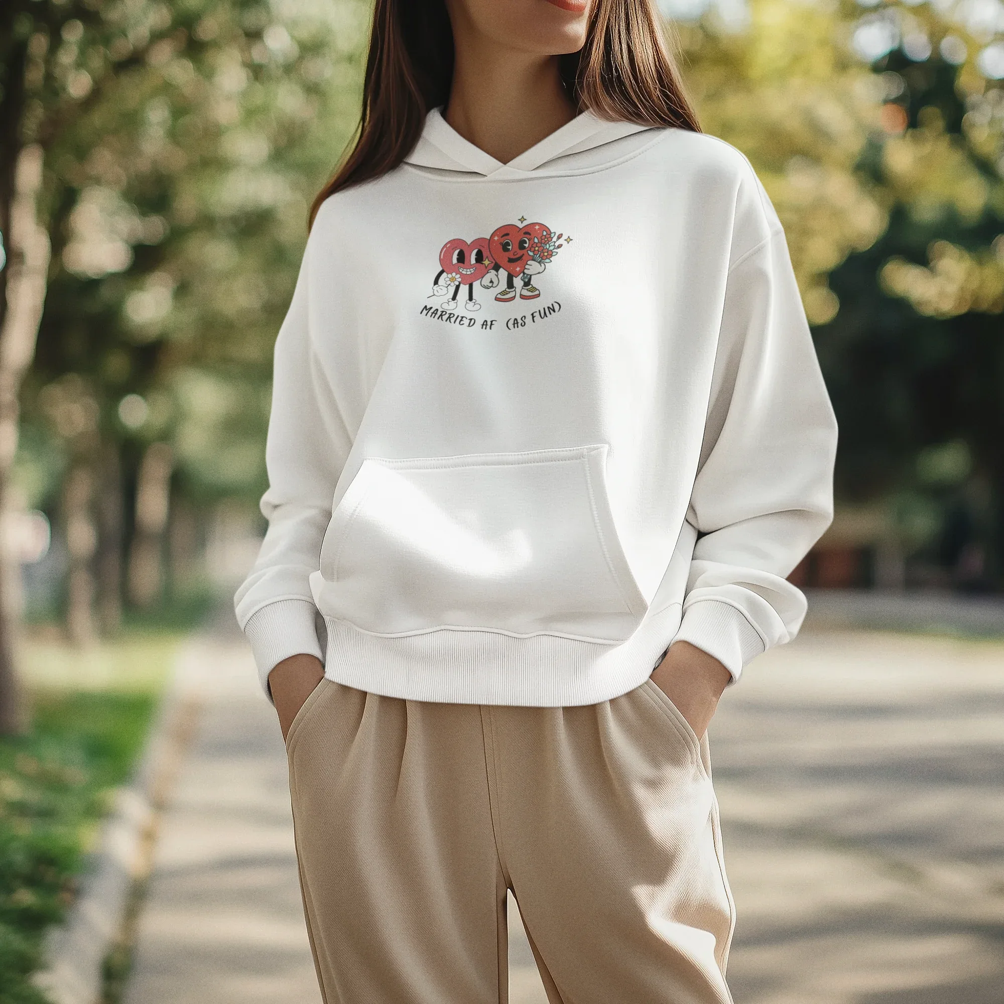 White hoodie sweatshirt with kangaroo pocket and hood, front cartoon heart graphic