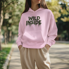 Light pink hoodie pullover with green "WILD INSIDE" graphic on the chest