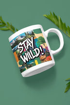 White ceramic mug with 'STAY WILD!' landscape graphic, side view with handle