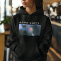 Black unisex hoodie with 'GOOD VIBES' front graphic and kangaroo pocket