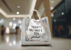 White tote bag with “Therapy?, No, I have a Tote” print, close-up, white handles