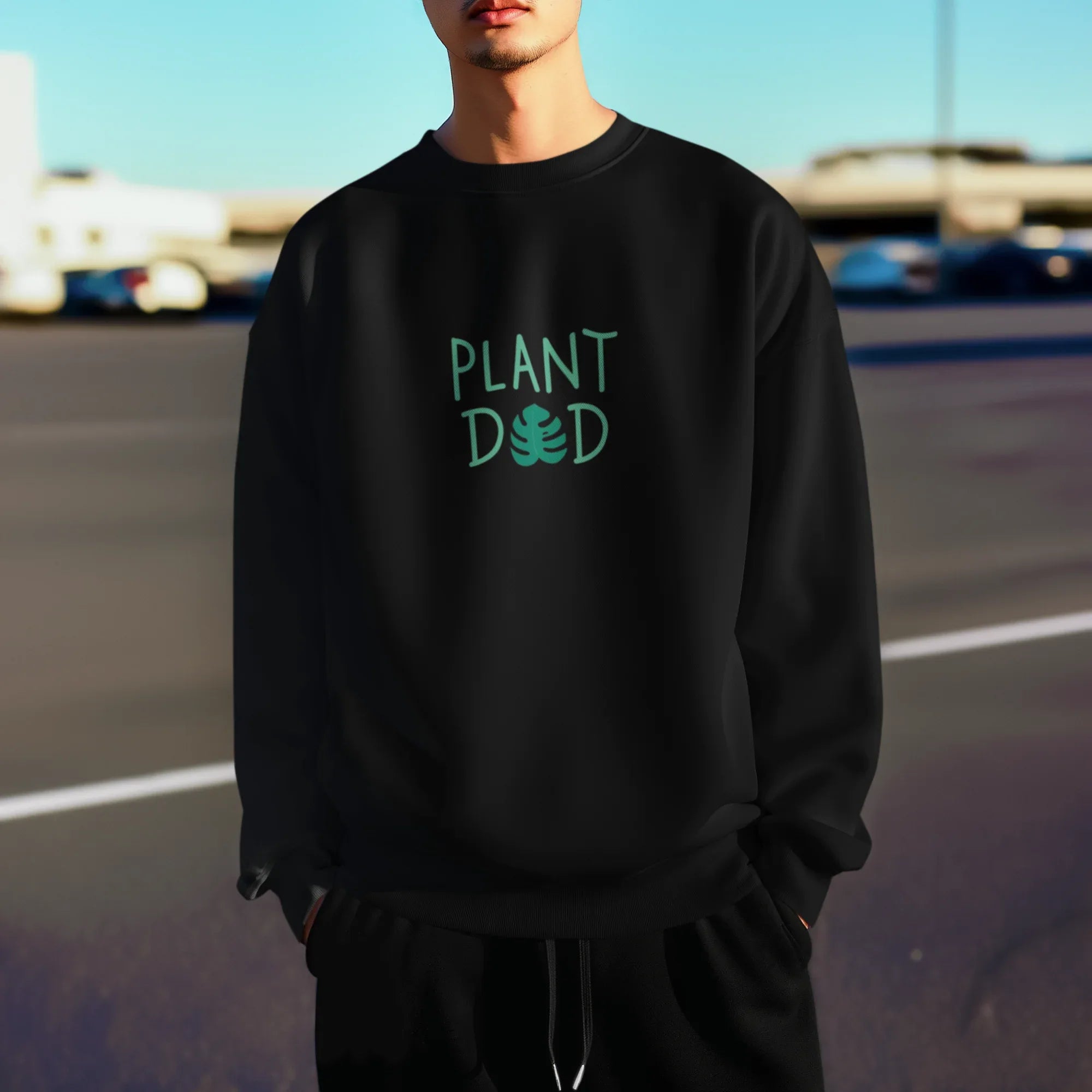 Deep black crewneck sweatshirt with Plant Dad graphic on the chest, long sleeves