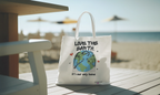 White tote bag with “Love the Earth” text and globe illustration
