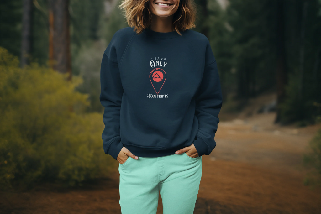 Navy crewneck sweatshirt with 'Leave Only Footprints' chest logo graphic