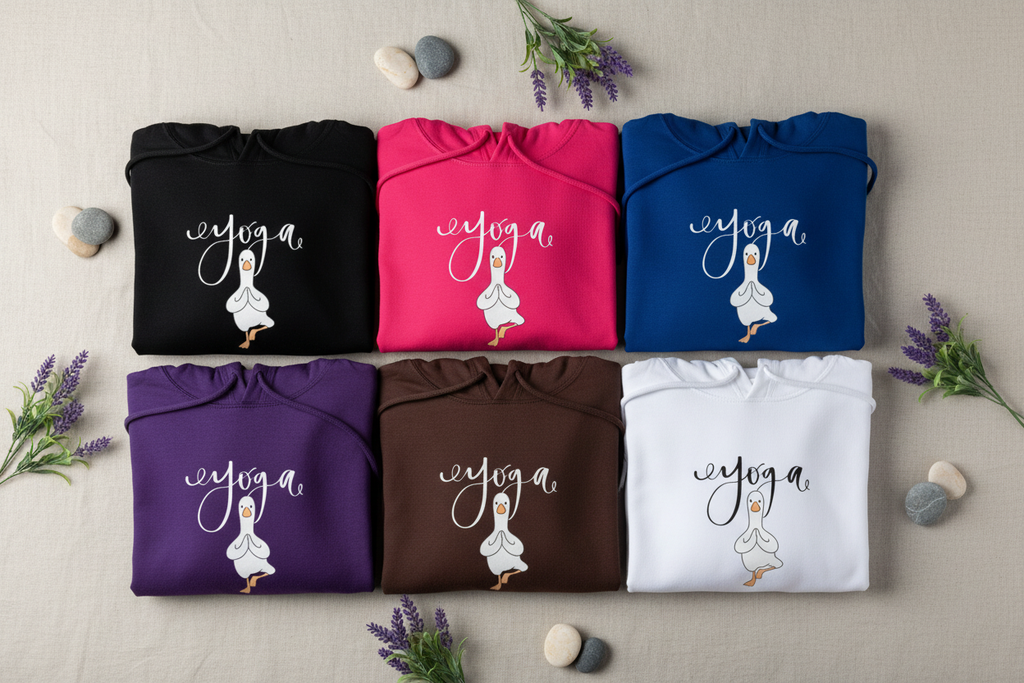 Assorted yoga hoodies with duck graphic, folded flat with pullover hood and pocket