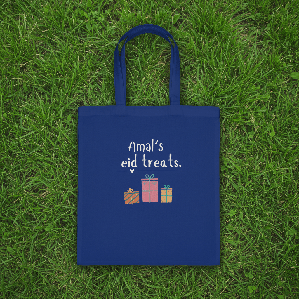 Navy blue cotton tote bag with handles and “Amal’s eid treats” text and gift icons.