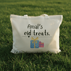 White cotton tote bag with “Amal’s eid treats” text and gift icons