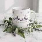 Personalised butterfly mug, white ceramic with purple butterflies and name Amelia on front