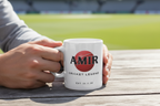 Personalised cricket mug with AMIR name and red cricket-ball logo, white ceramic