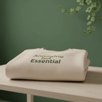 Light sand unisex sweatshirt stacked with 'Annoying but Essential' slogan