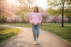 Pink crewneck sweatshirt with "Good things ahead" chest graphic