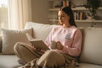 Pink crewneck sweatshirt with small "Good things ahead" chest print