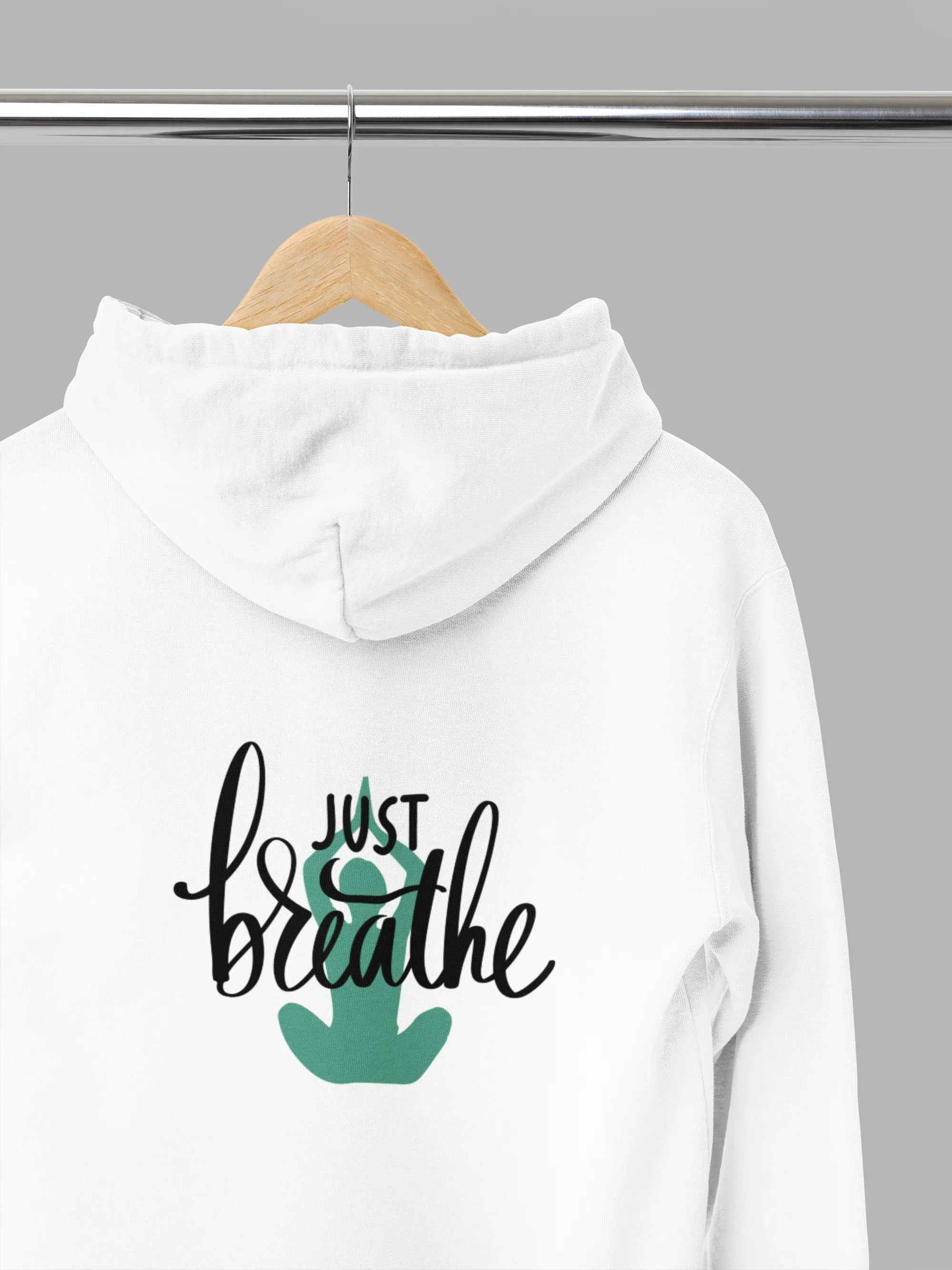 White hoodie with front pocket, drawstring hood, and 'Just Breathe' logo