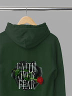 Forest green unisex hoodie with hood, front pocket, and Faith over Fear rose chest graphic