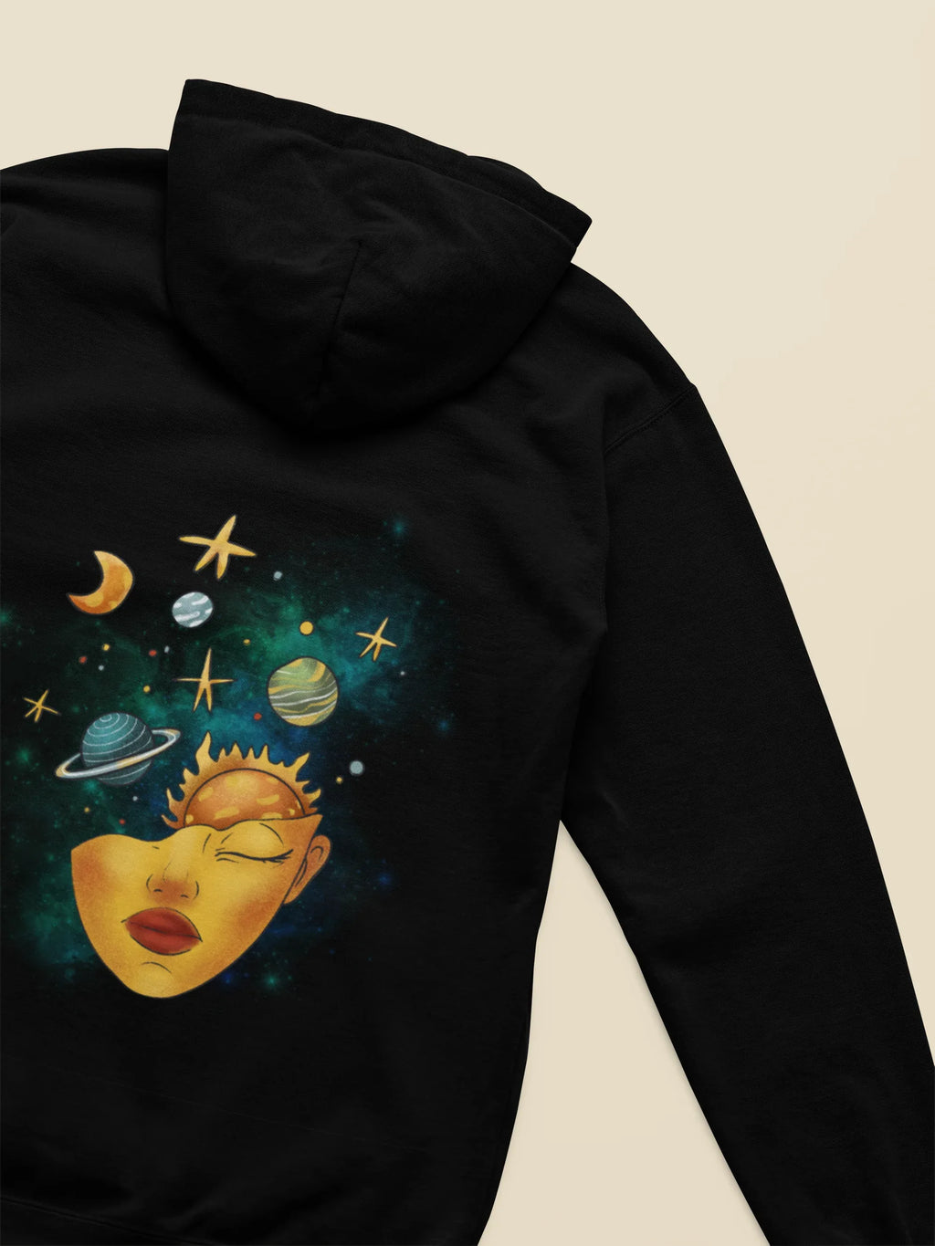 Black hoodie close-up showing space face graphic on back sleeve