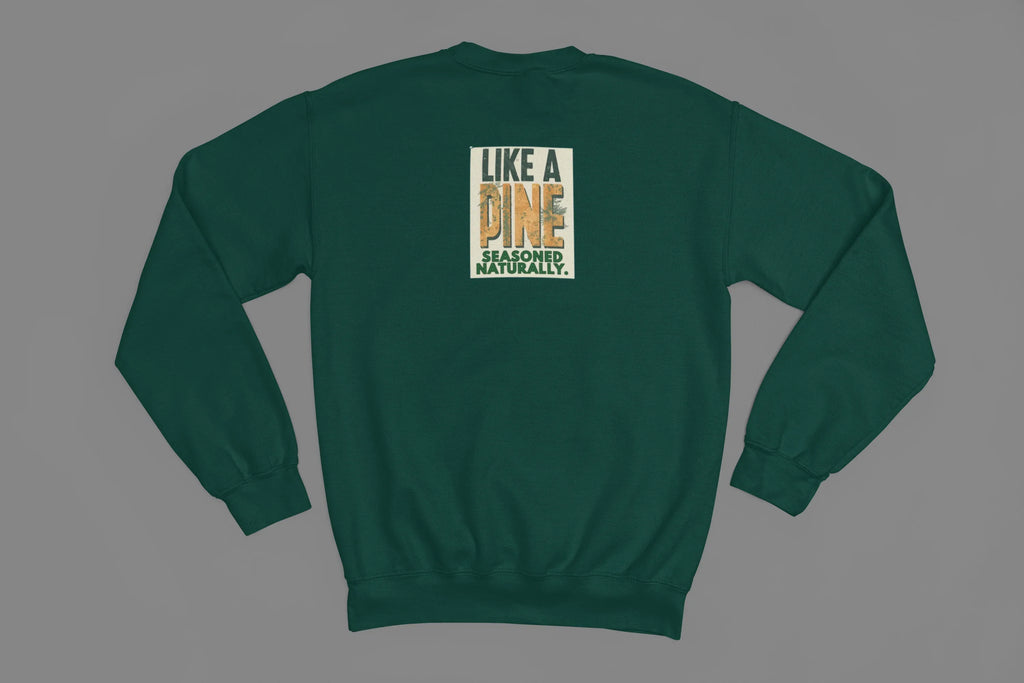 Green sweatshirt back view with small square “Like a Pine” logo centered