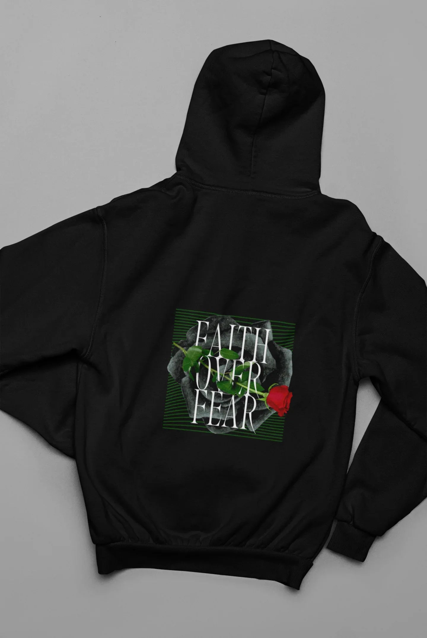 Black unisex hoodie with hood, front pocket, and Faith over Fear rose square graphic