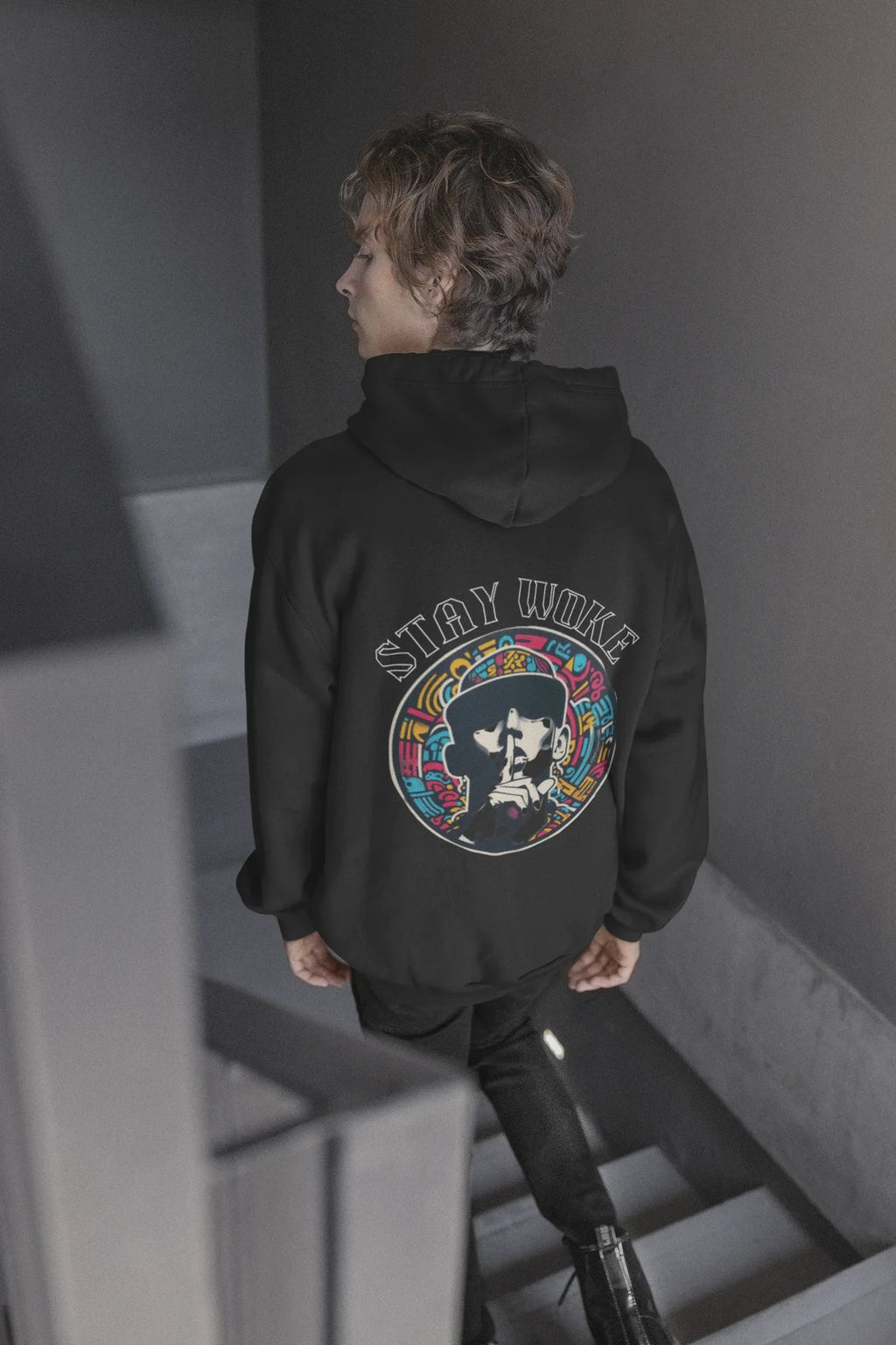Black hooded sweatshirt, back view with circular graphic emblem