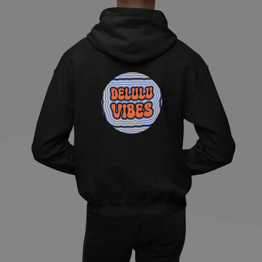 Black hoodie worn with hood down; circular "DELULU VIBES" graphic on back