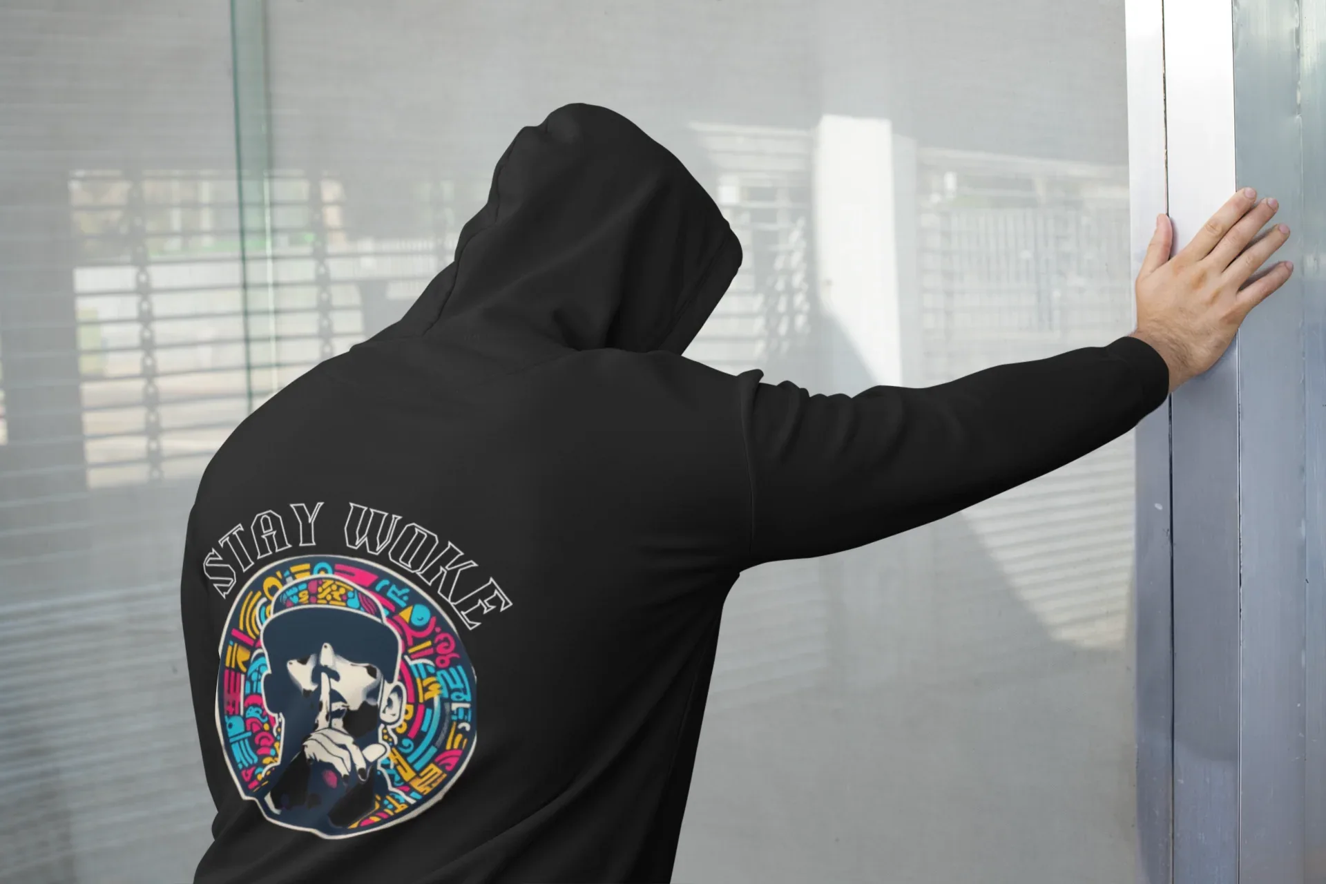 Black hooded sweatshirt with back circular graphic and extended sleeves
