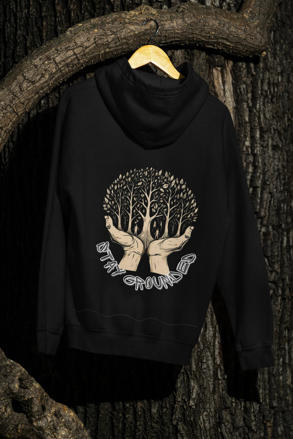 Black hoodie on hanger with front chest tree graphic and hood