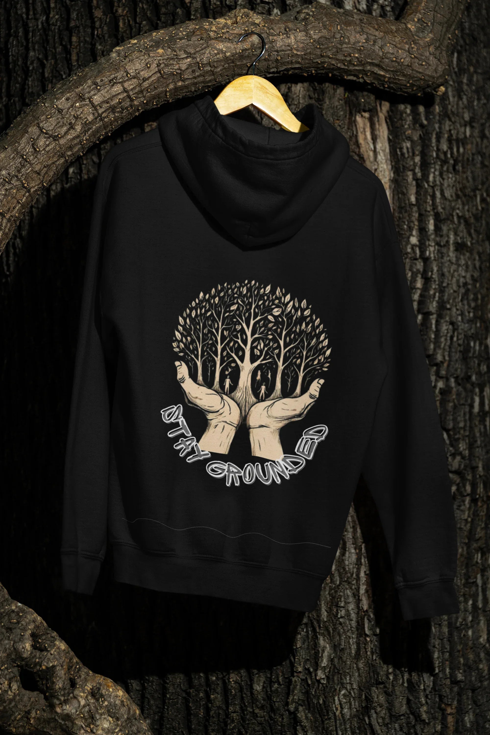 Black hoodie on hanger with front chest tree graphic and hood